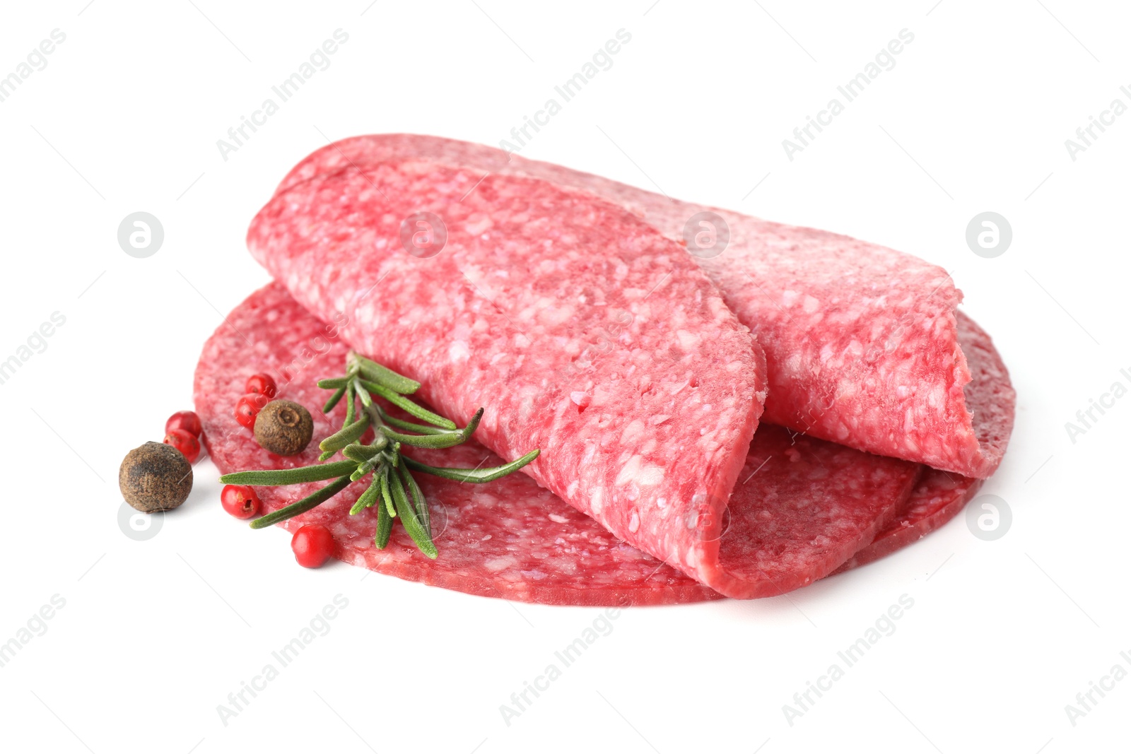 Slices of tasty smoked sausage with spices isolated on white Photo of Slices of tasty smoked sausage with spices isolated on white