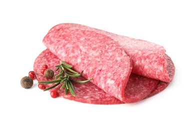 Photo of Slices of tasty smoked sausage with spices isolated on white