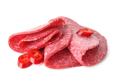 Photo of Slices of tasty smoked sausage and chili pepper isolated on white