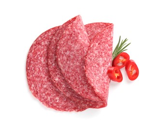 Photo of Slices of tasty smoked sausage, rosemary and chili pepper isolated on white, top view
