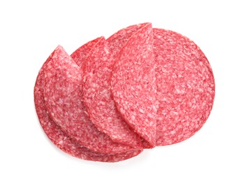 Photo of Slices of tasty smoked sausage isolated on white, top view