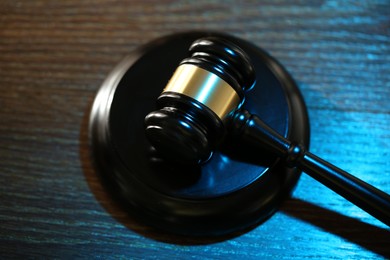 Photo of Judge's gavel and sound block on wooden table, above view