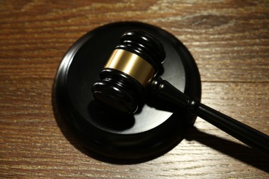 Photo of Judge's gavel and sound block on wooden table, above view