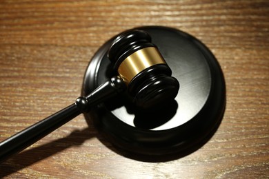Photo of Judge's gavel and sound block on wooden table, above view