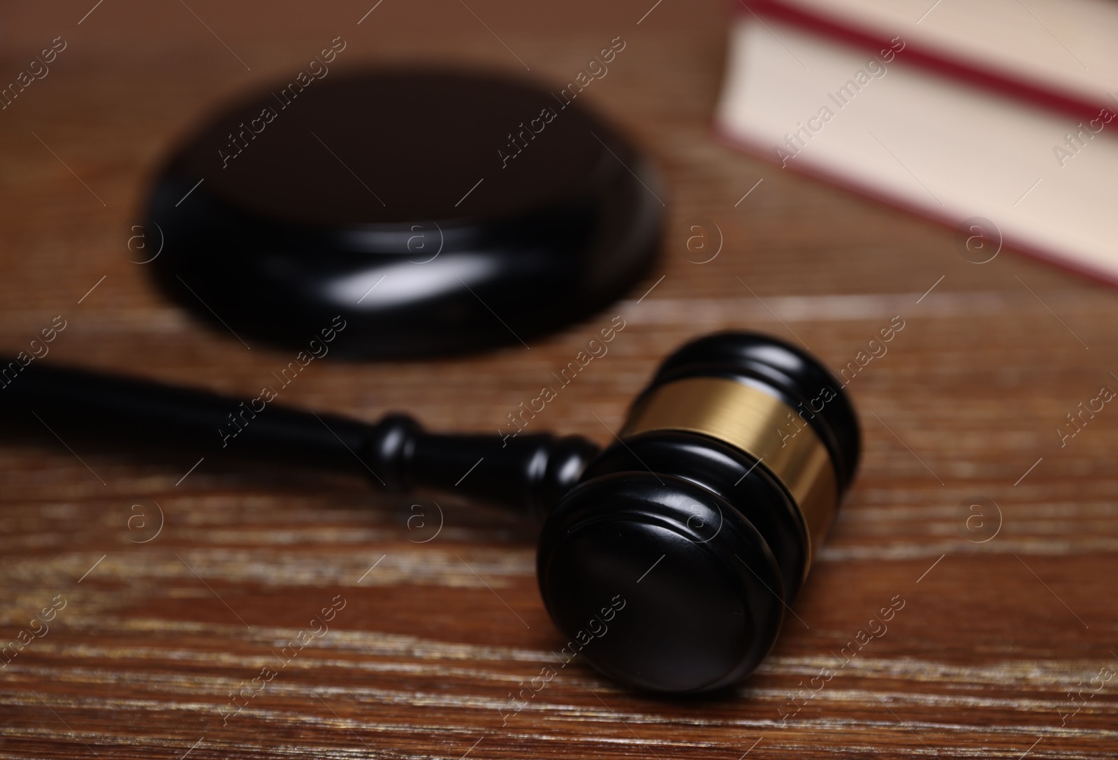 Judge's gavel and sound block on wooden table, closeup Photo of Judge's gavel and sound block on wooden table, closeup