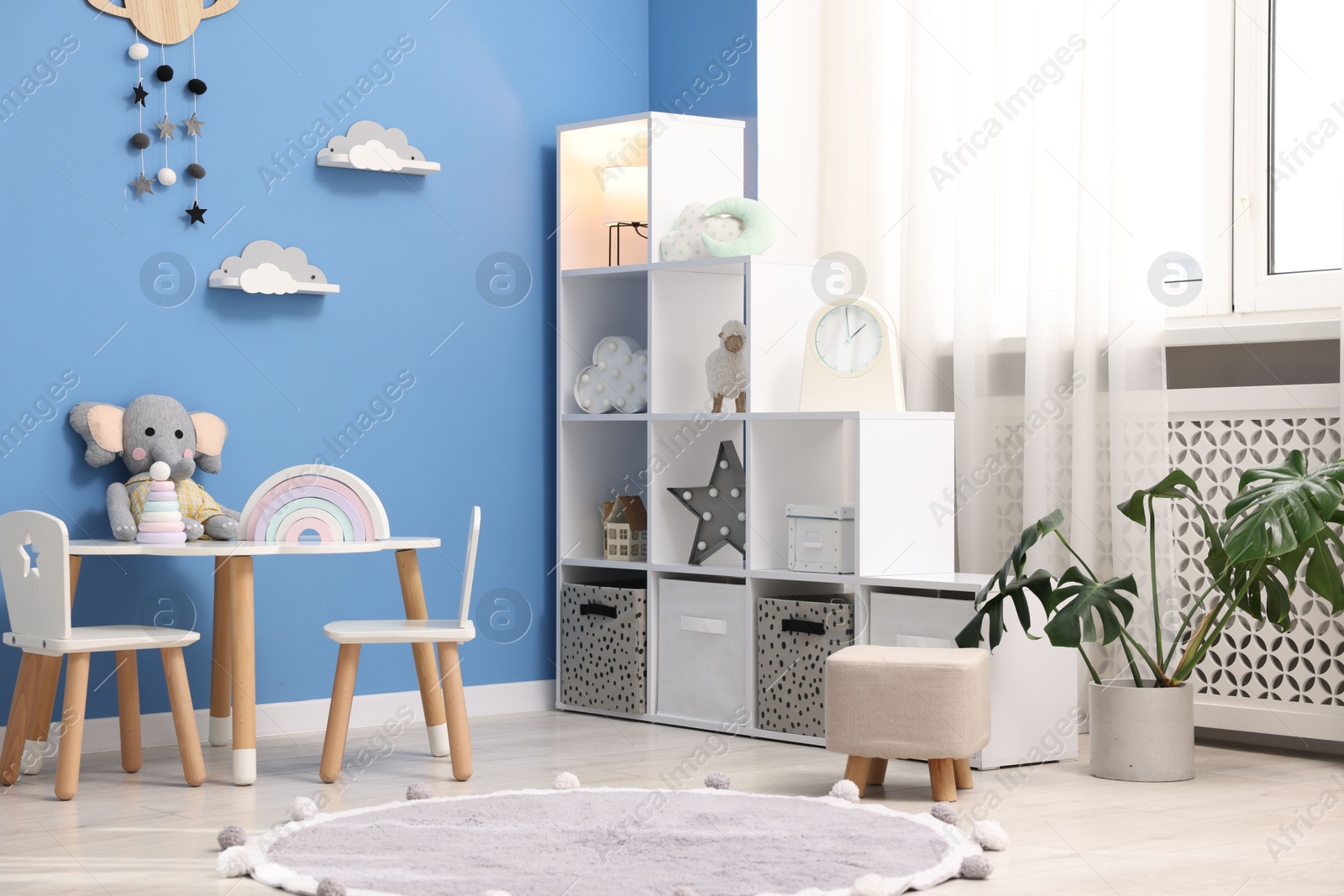 Child's room with stylish furniture and toys. Interior design Photo of Child's room with stylish furniture and toys. Interior design