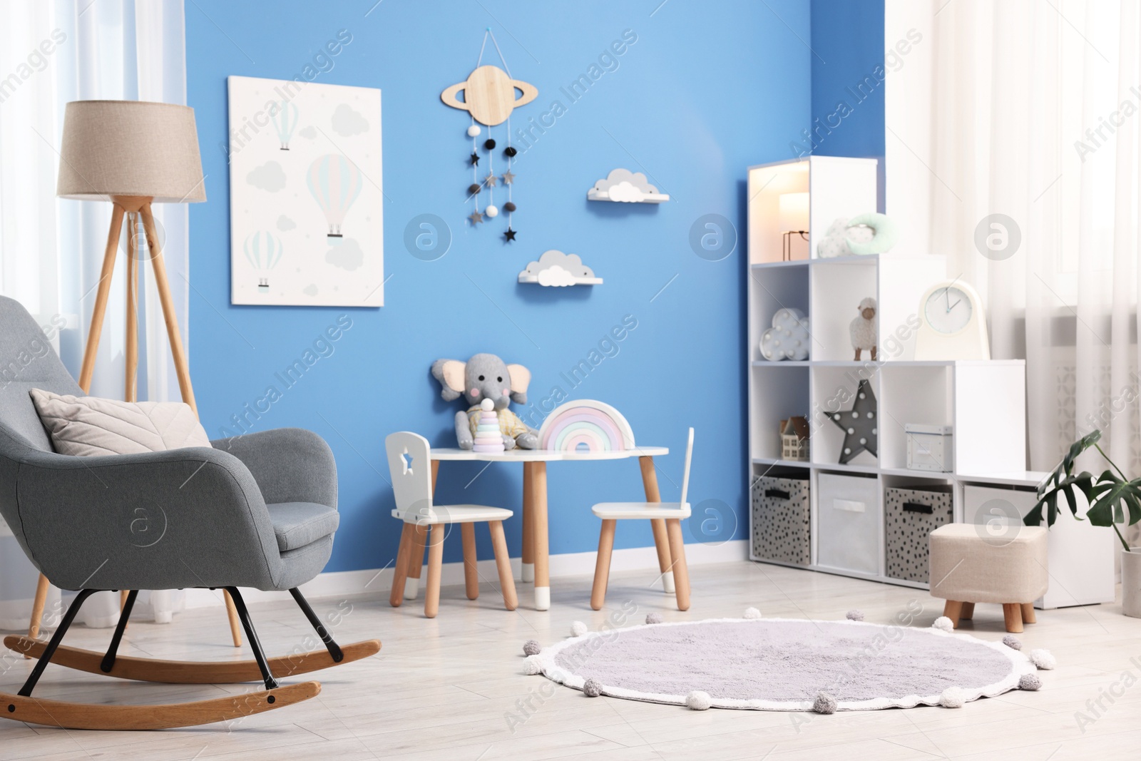 Child's room with stylish furniture and toys. Interior design Photo of Child's room with stylish furniture and toys. Interior design