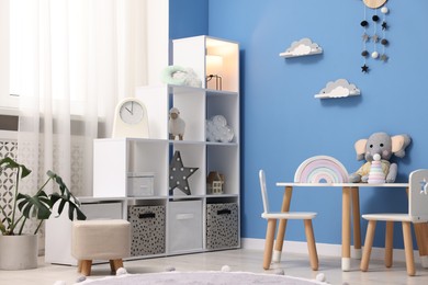 Photo of Child's room with stylish furniture and toys. Interior design