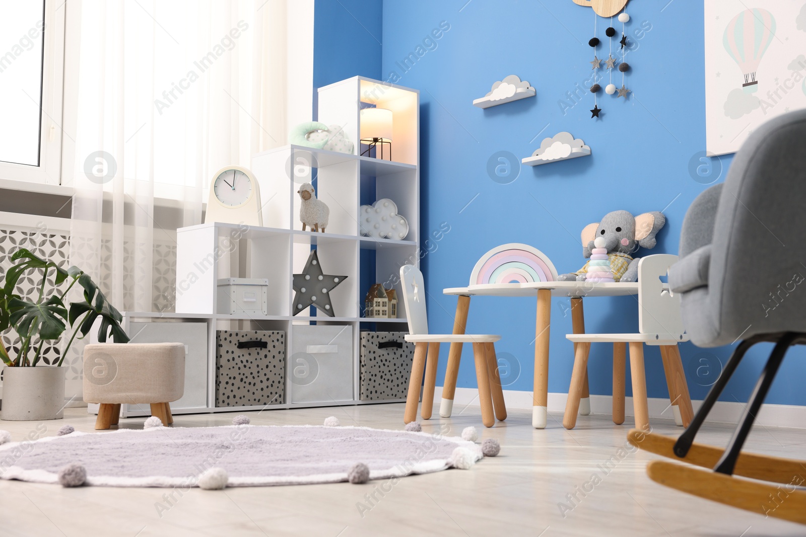 Child's room with stylish furniture and toys. Interior design, low angle view Photo of Child's room with stylish furniture and toys. Interior design, low angle view