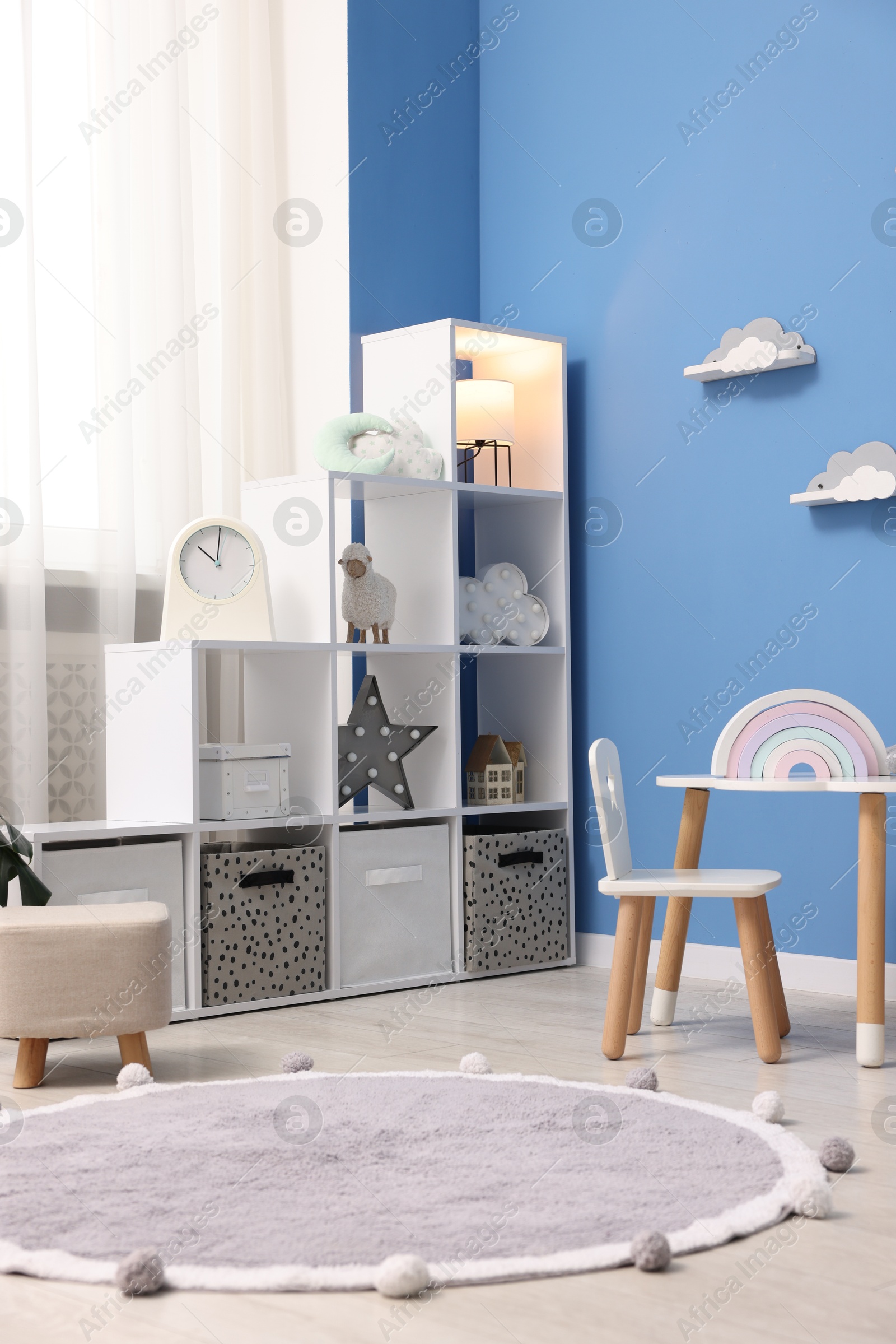 Child's room with stylish furniture and toys. Interior design Photo of Child's room with stylish furniture and toys. Interior design