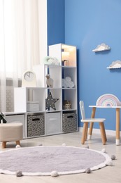 Photo of Child's room with stylish furniture and toys. Interior design