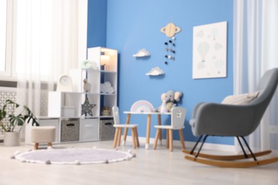 Photo of Child's room with stylish furniture and toys. Interior design