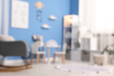 Photo of Blurred view of stylish child's room. Interior design