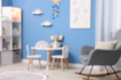 Photo of Blurred view of stylish child's room. Interior design