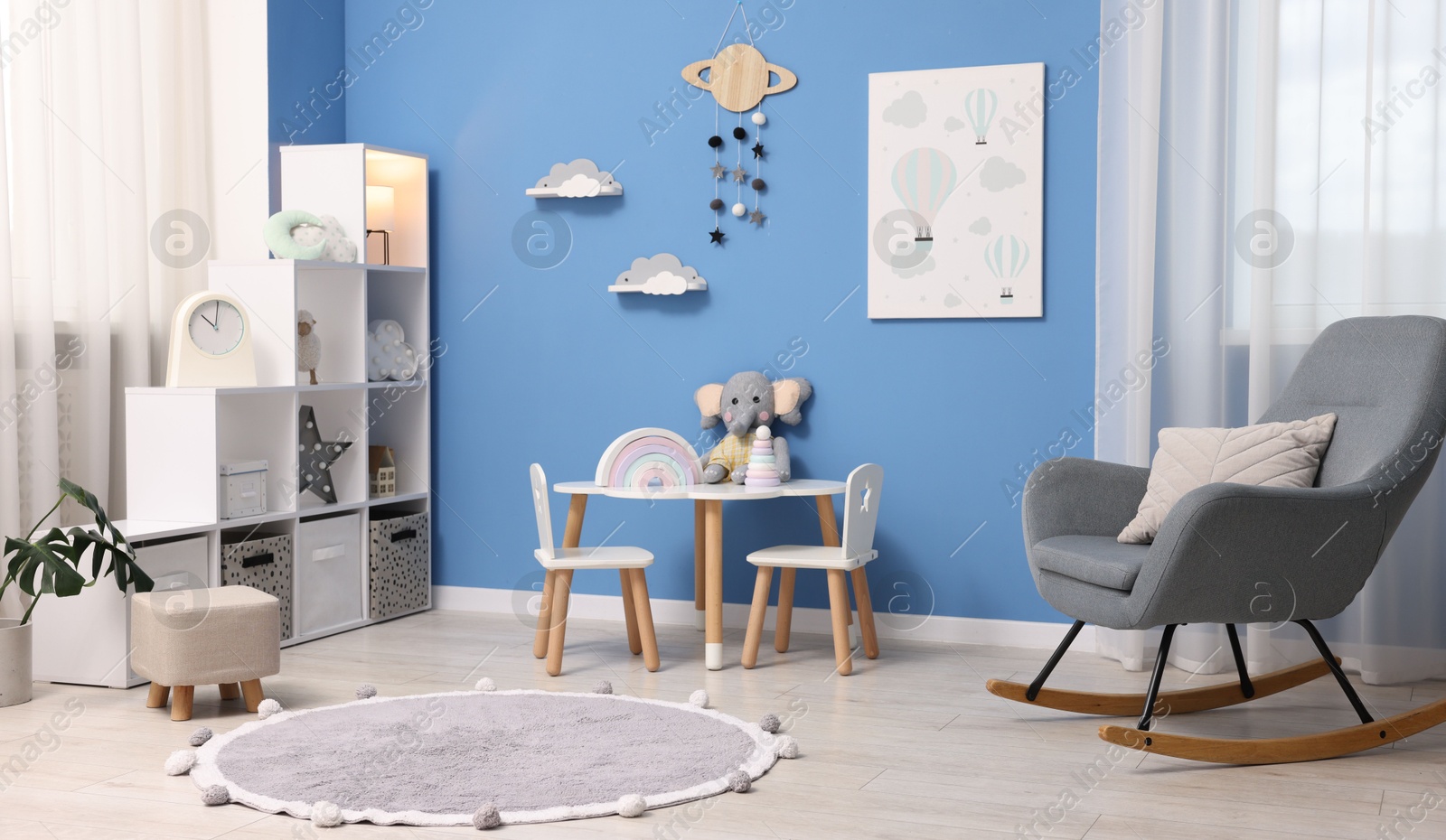 Child's room with stylish furniture and toys. Interior design Photo of Child's room with stylish furniture and toys. Interior design