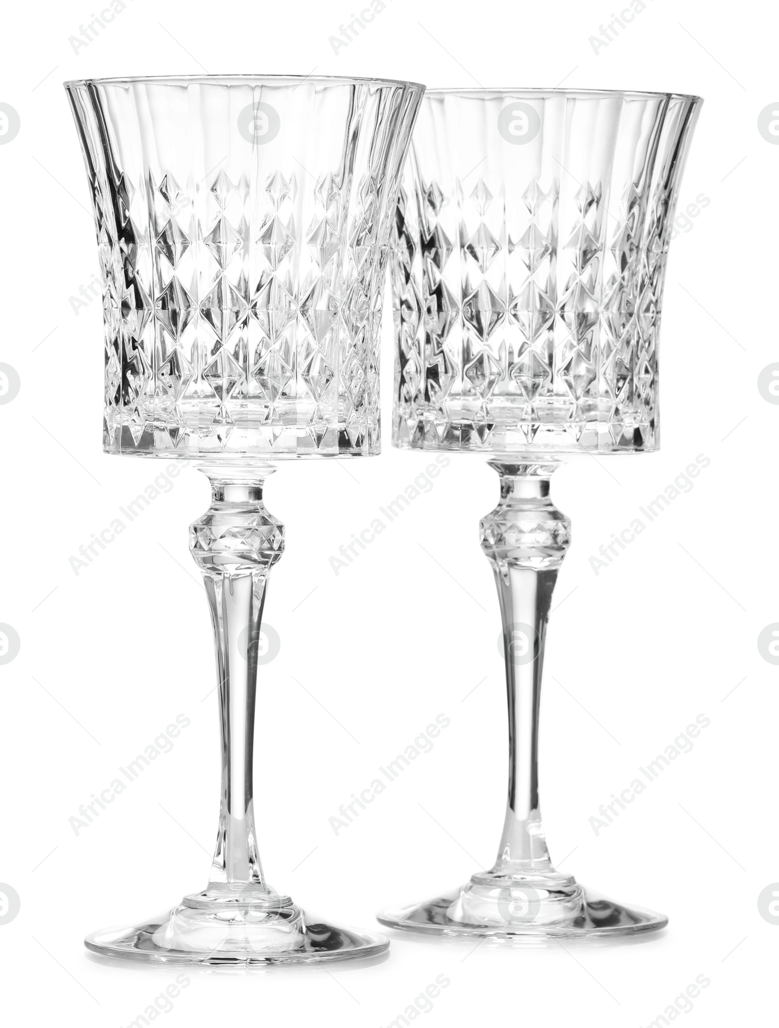 Two empty clean glasses isolated on white Photo of Two empty clean glasses isolated on white