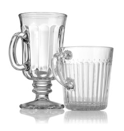 Photo of Different empty clean glasses isolated on white