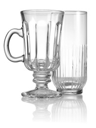 Photo of Different empty clean glasses isolated on white