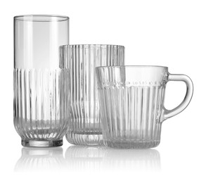 Photo of Different empty clean glasses isolated on white
