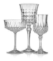 Photo of Different empty clean glasses isolated on white