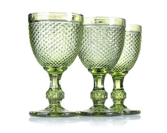 Photo of Three empty clean glasses isolated on white