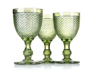 Photo of Three empty clean glasses isolated on white