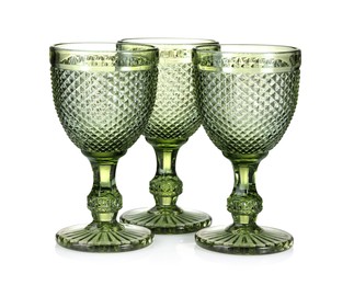 Photo of Three empty clean glasses isolated on white
