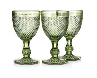 Photo of Three empty clean glasses isolated on white