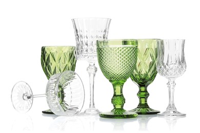 Photo of Different empty clean glasses isolated on white