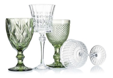 Photo of Different empty clean glasses isolated on white