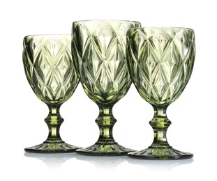 Photo of Three empty clean glasses isolated on white