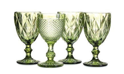 Photo of Many empty clean glasses isolated on white