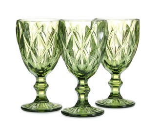 Photo of Three empty clean glasses isolated on white