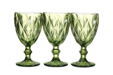 Photo of Three empty clean glasses isolated on white