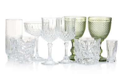 Photo of Different empty clean glasses isolated on white