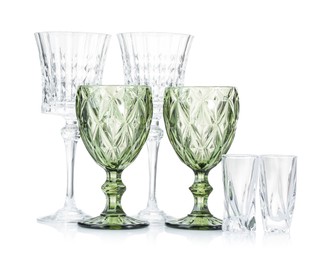 Photo of Different empty clean glasses isolated on white