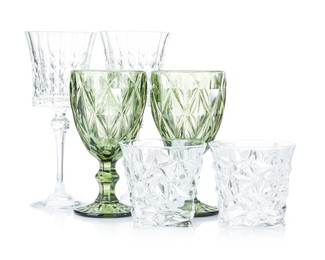 Photo of Different empty clean glasses isolated on white