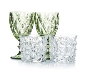 Photo of Different empty clean glasses isolated on white