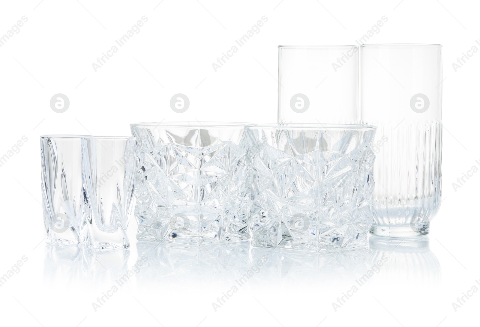 Different empty clean glasses isolated on white Photo of Different empty clean glasses isolated on white