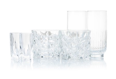 Photo of Different empty clean glasses isolated on white