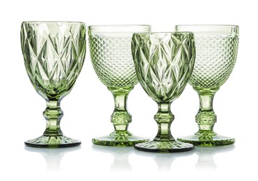 Photo of Different empty clean glasses isolated on white