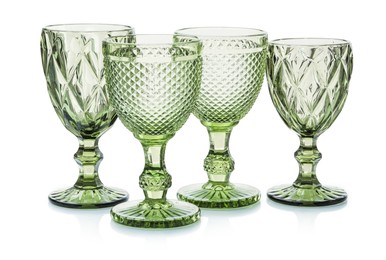 Photo of Different empty clean glasses isolated on white