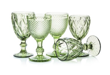 Photo of Different empty clean glasses isolated on white