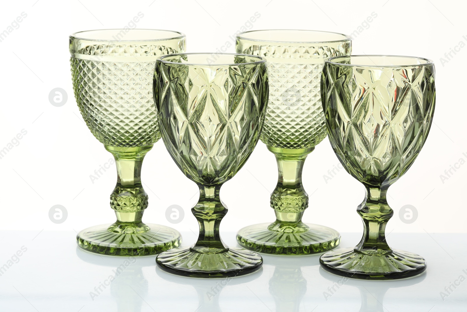Different empty clean glasses isolated on white Photo of Different empty clean glasses isolated on white