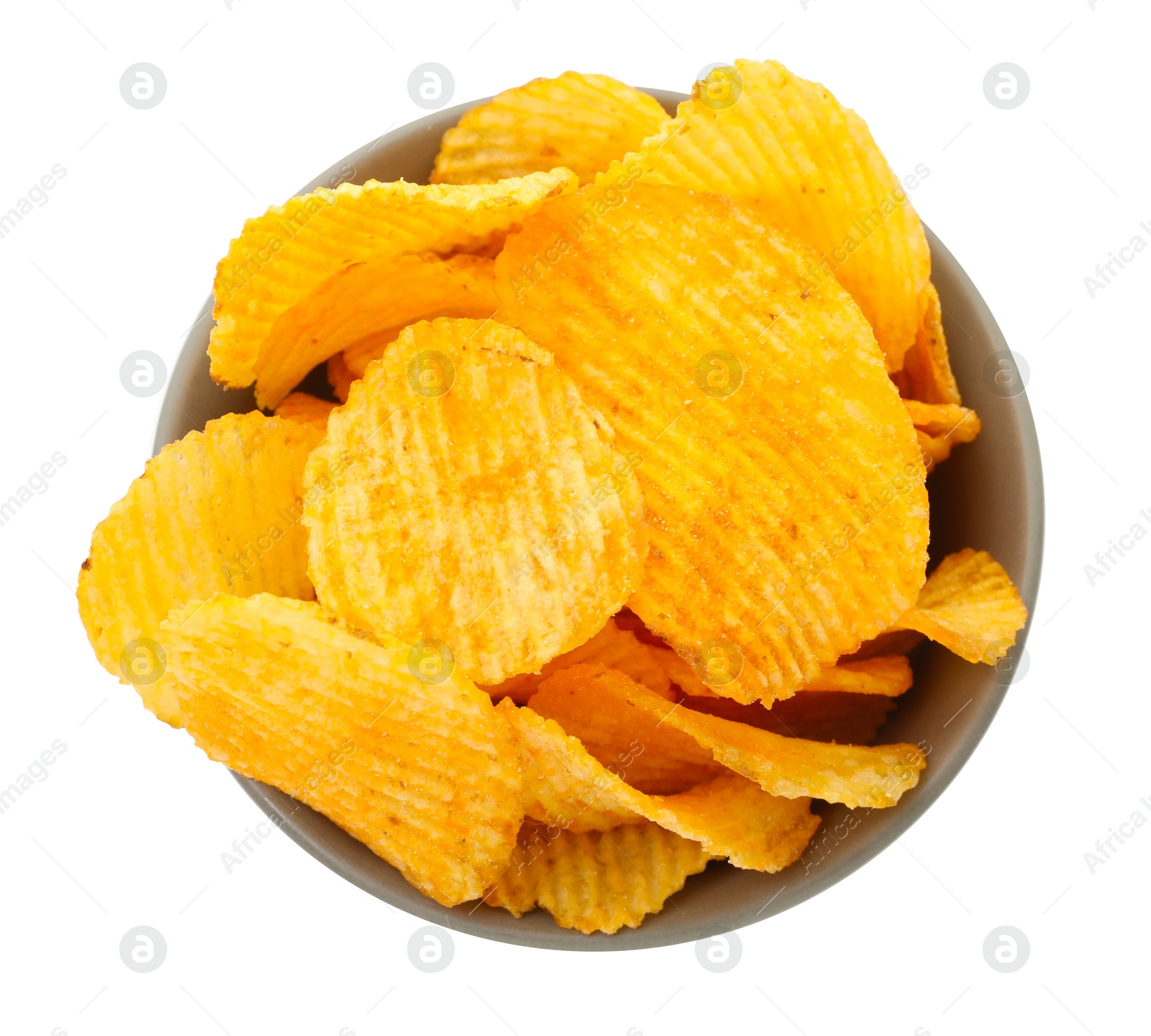 Tasty ridged chips in bowl isolated on white, top view Photo of Tasty ridged chips in bowl isolated on white, top view