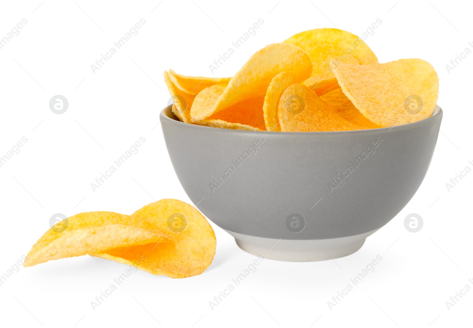Tasty chips in bowl isolated on white Photo of Tasty chips in bowl isolated on white