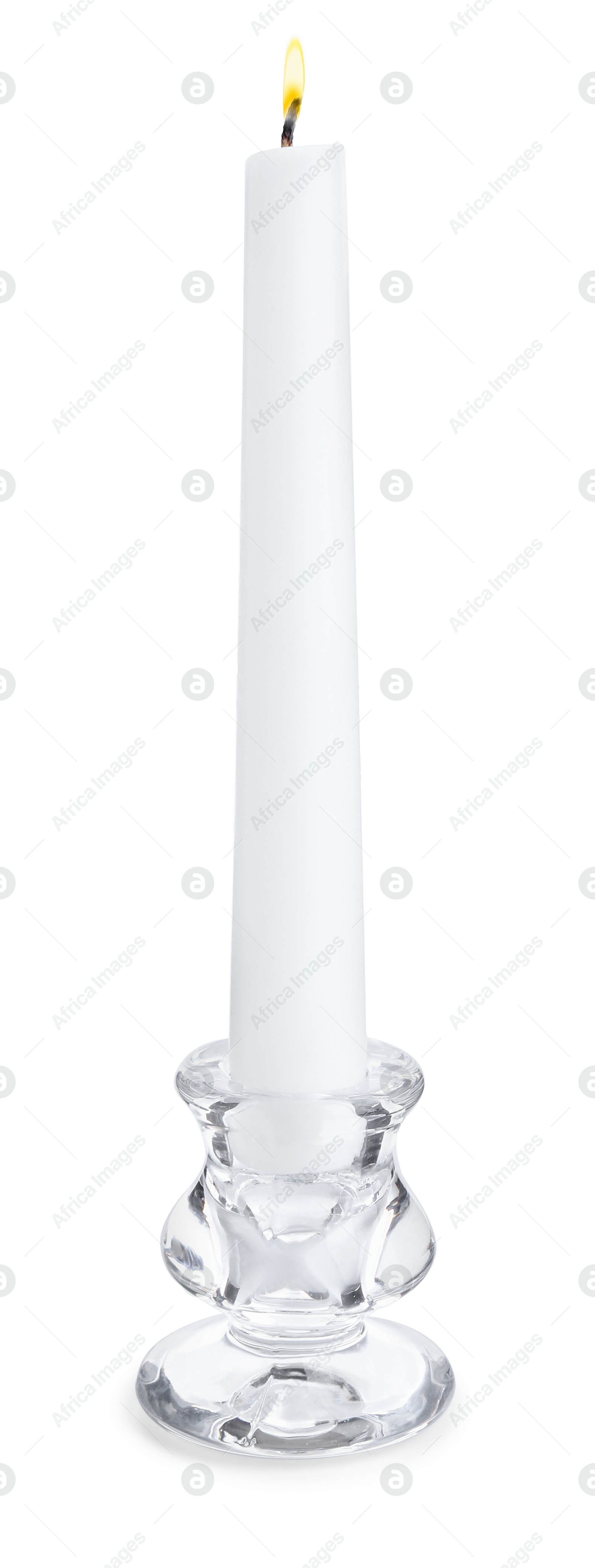 Photo of Burning candle in candlestick isolated on white