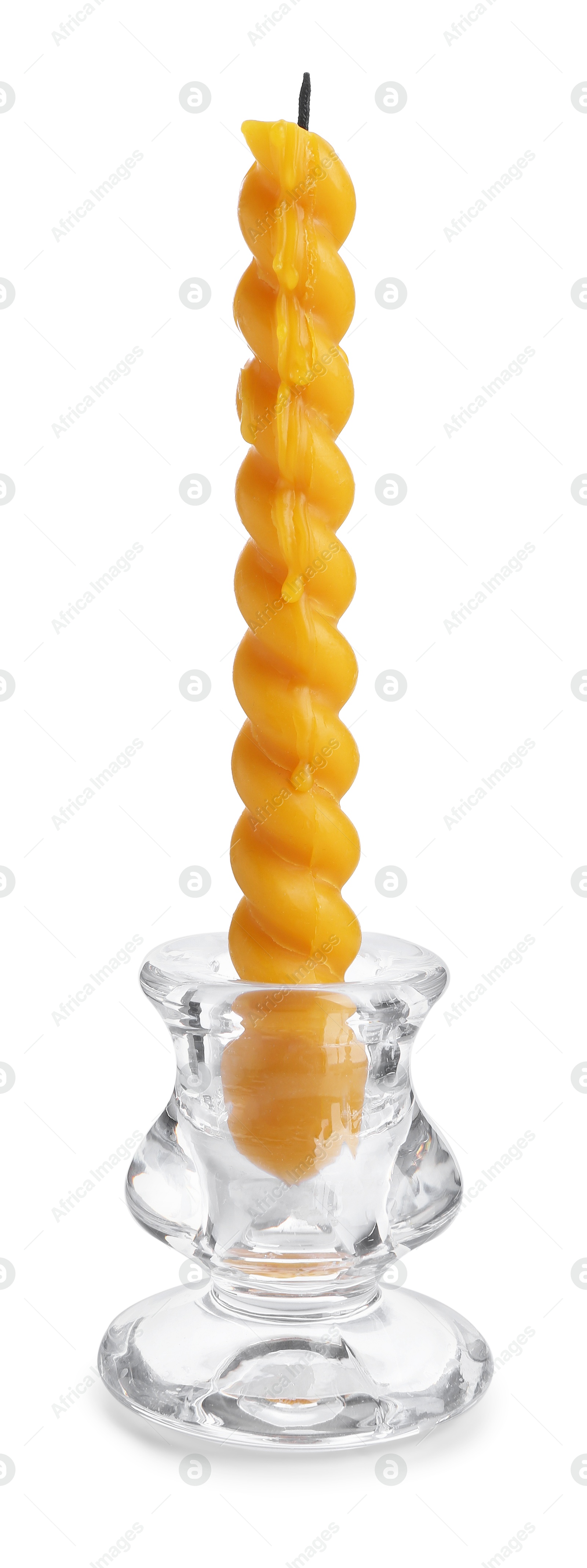 Beeswax candle in candlestick isolated on white Photo of Beeswax candle in candlestick isolated on white