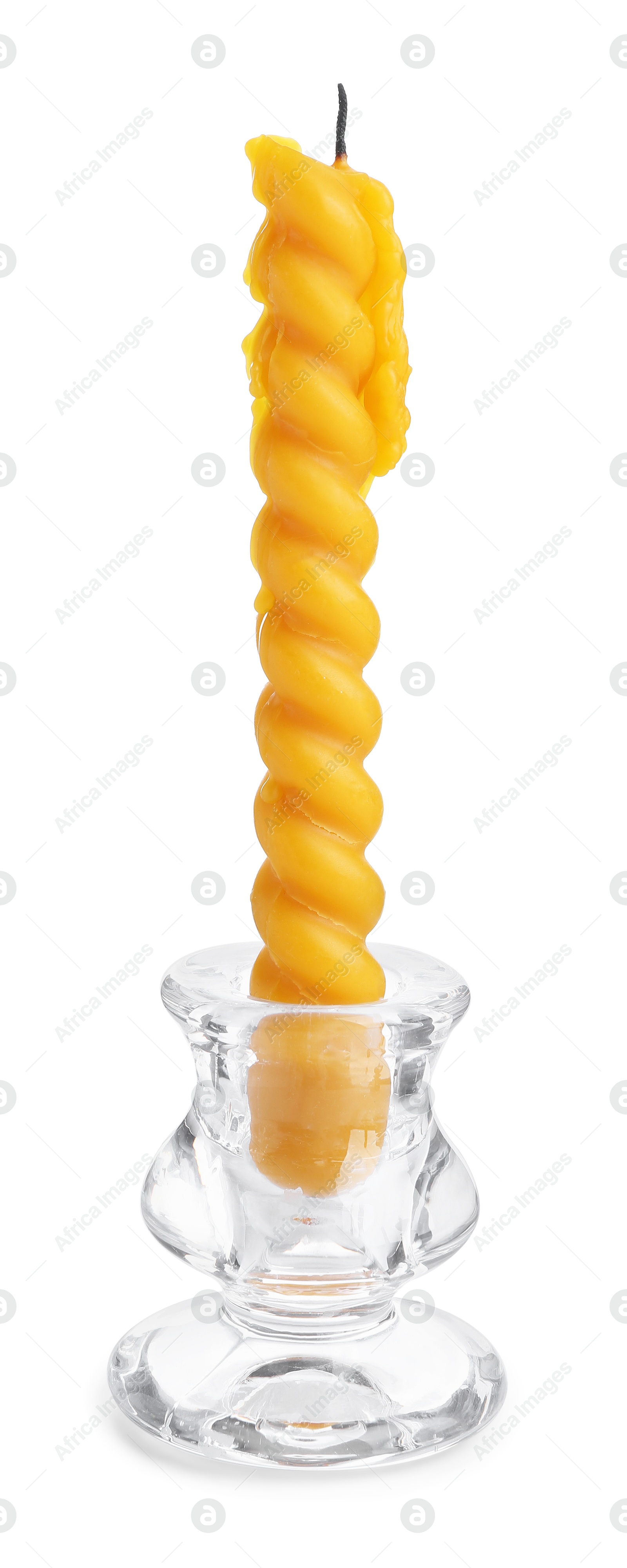 Beeswax candle in candlestick isolated on white Photo of Beeswax candle in candlestick isolated on white