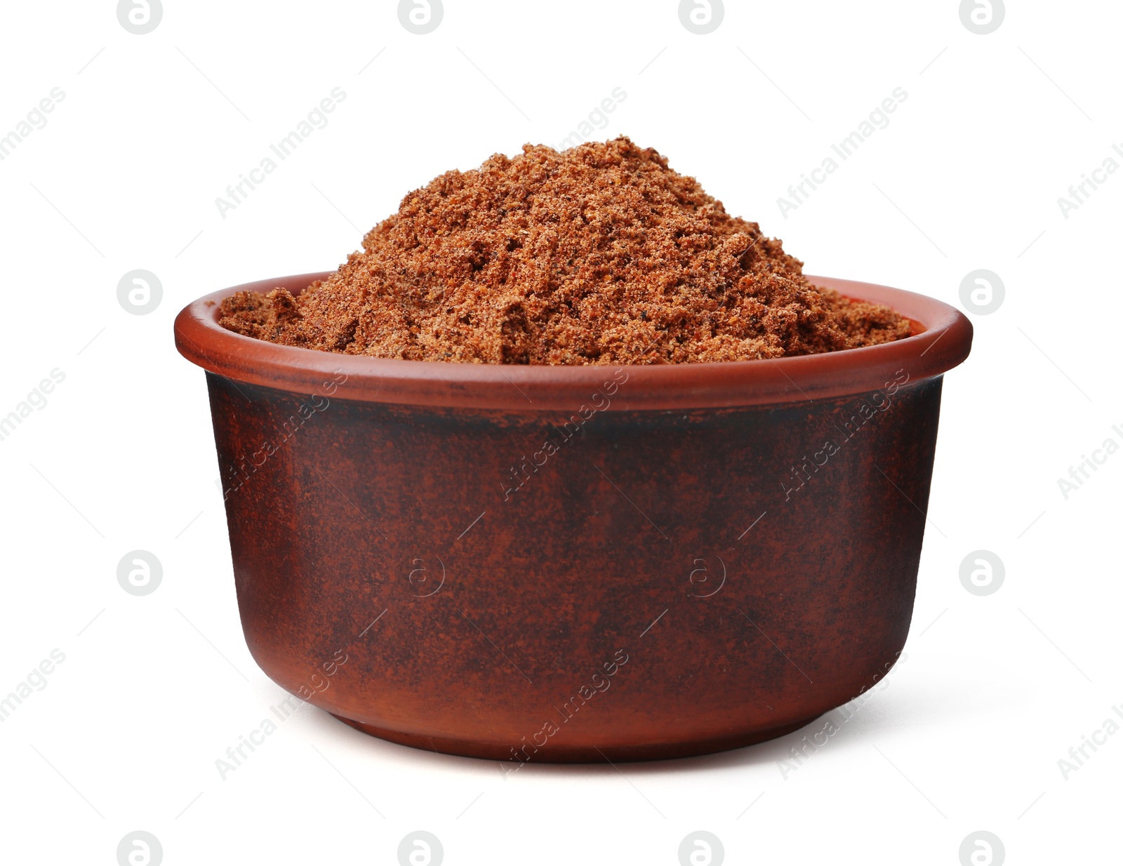 Superfood. Nutmeg powder in bowl isolated on white Photo of Superfood. Nutmeg powder in bowl isolated on white